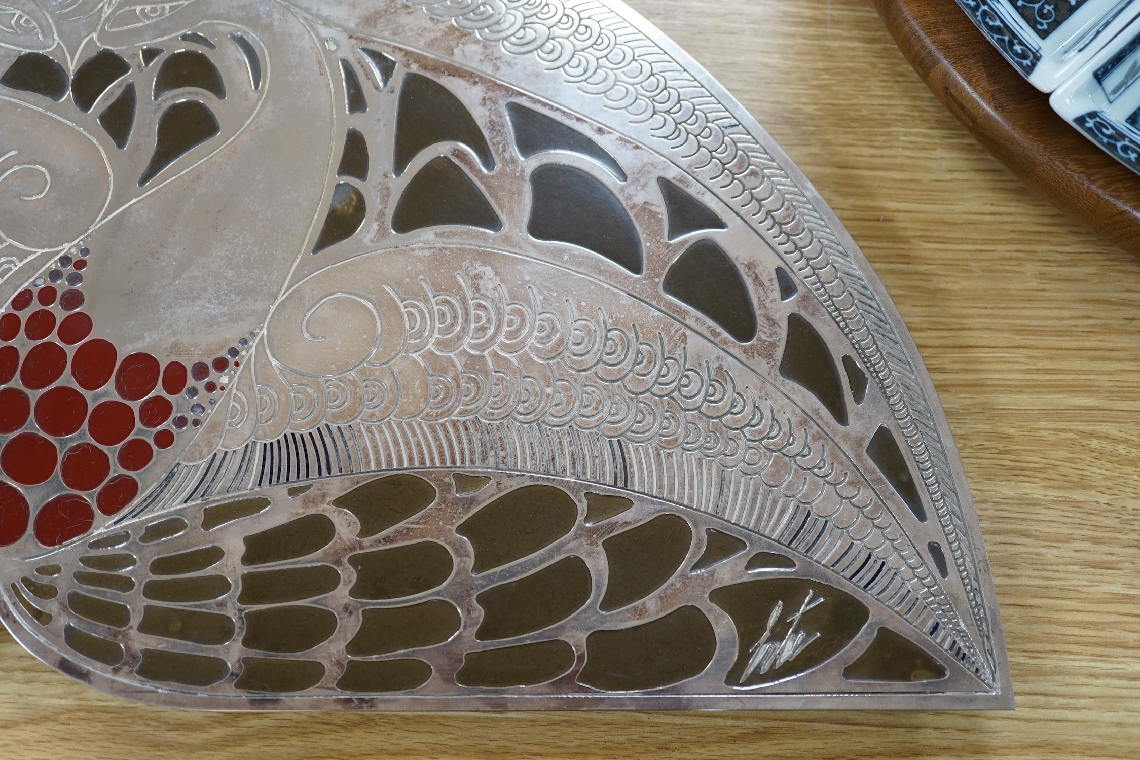 After Erte. A decorative panel or stand, with stylised decoration, 62cm wide